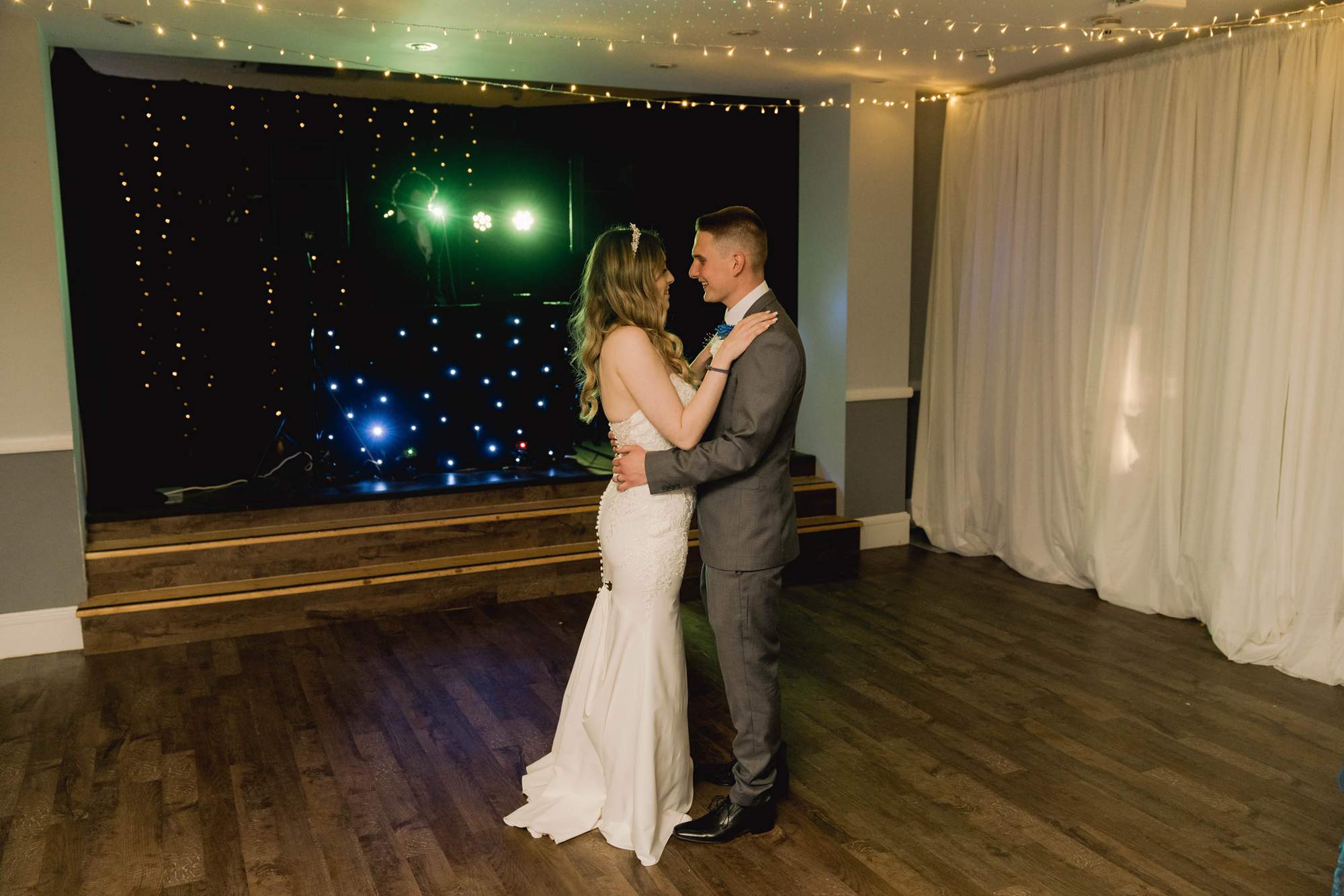 A bride and groom having their first dance at Avisford Park.