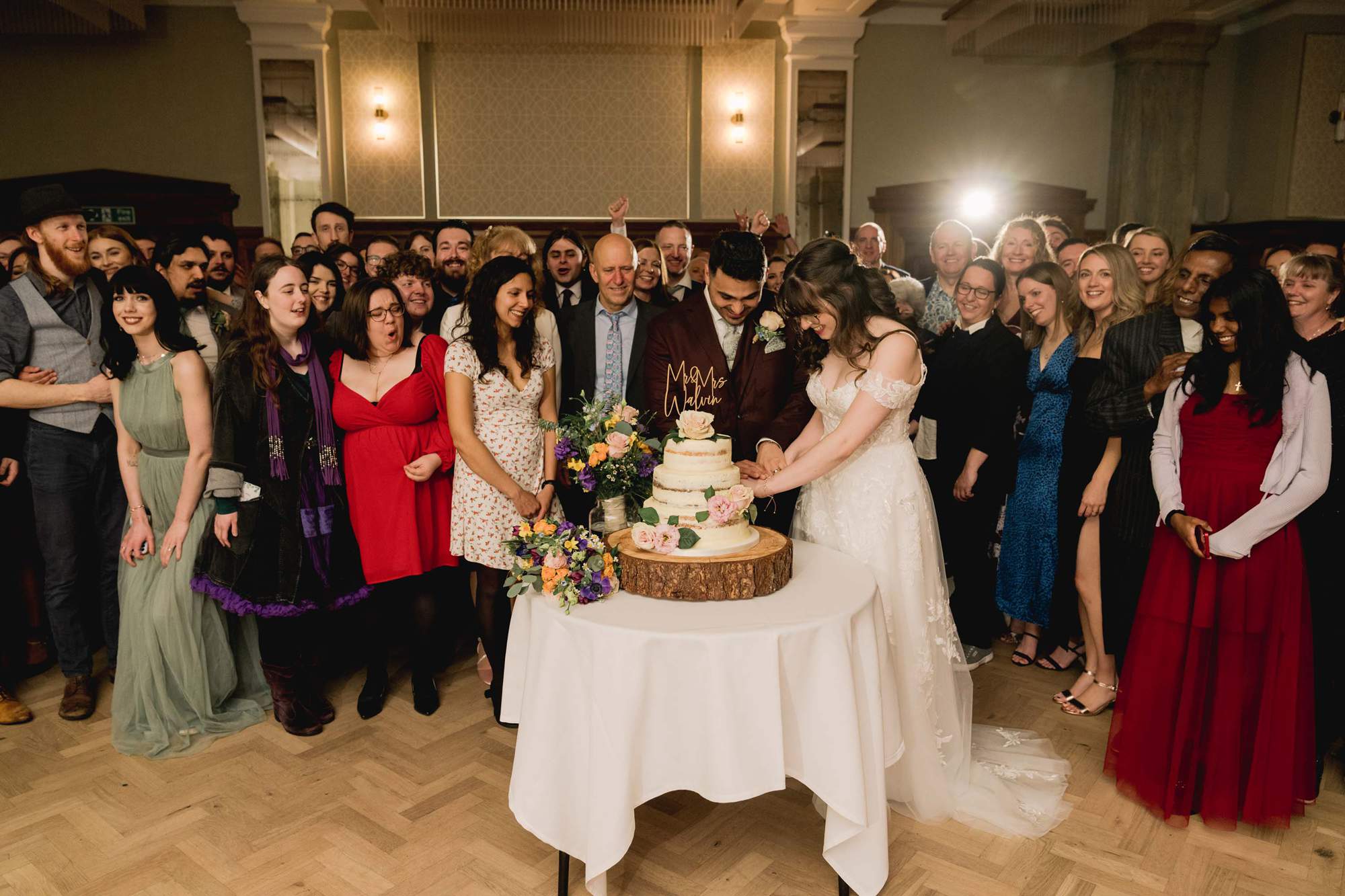 Bride and groom cut the cake at Pelham house.
