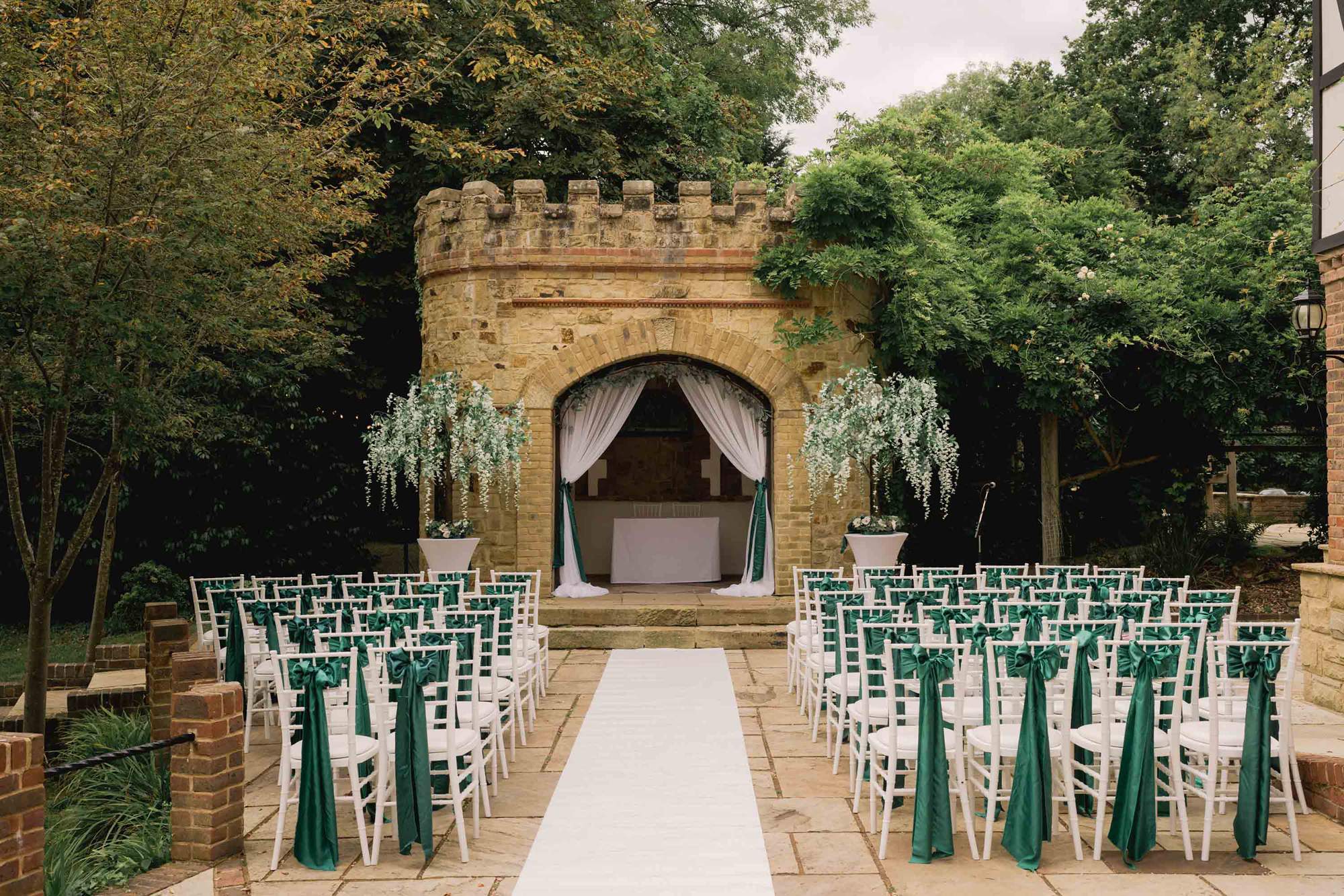 Outdoor wedding ceremony set up at the Ravenswood Hotel in Sussex.