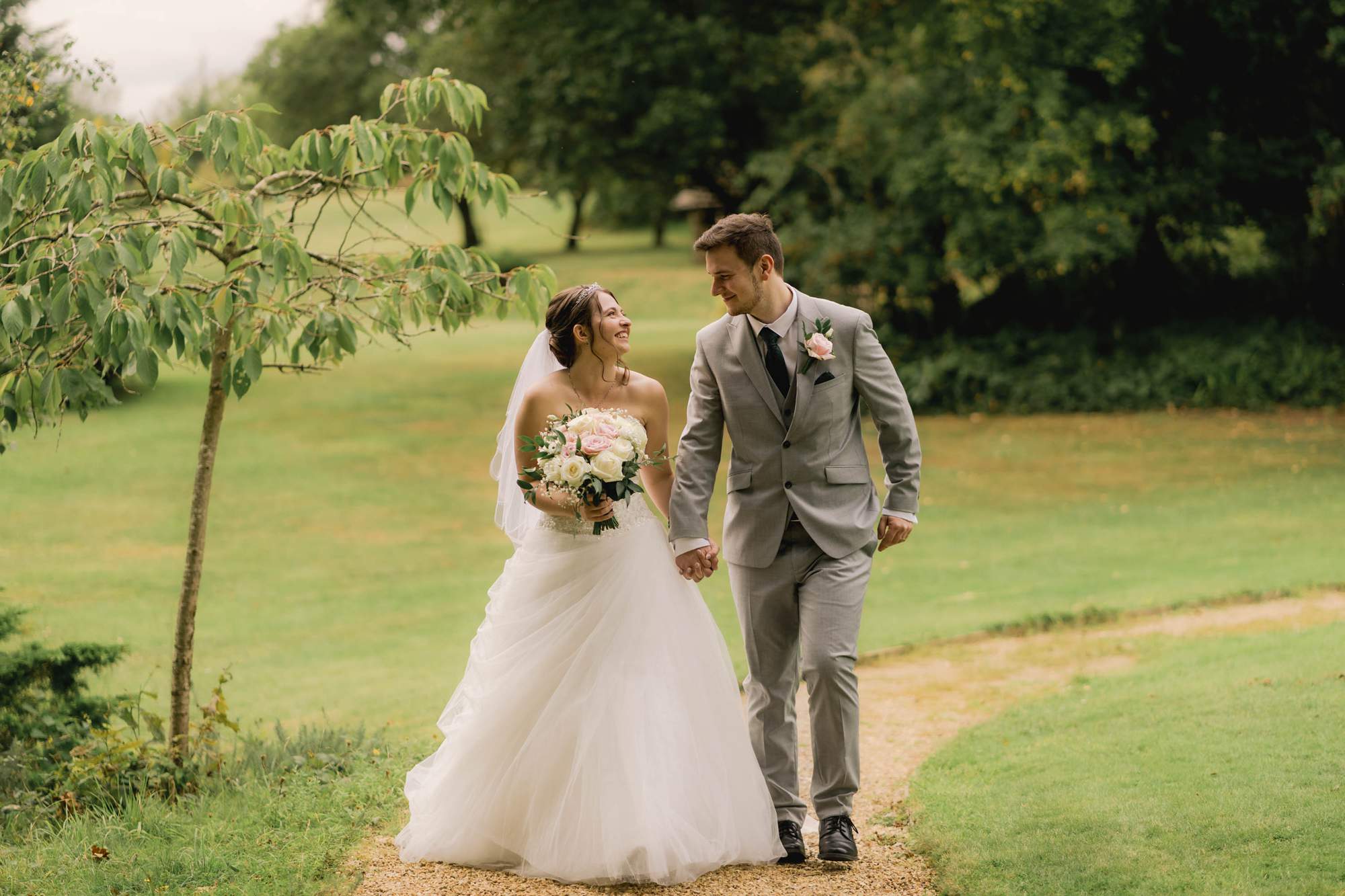 Newly married couple take a stroll at the Ravenswood Hotel in Sussex.