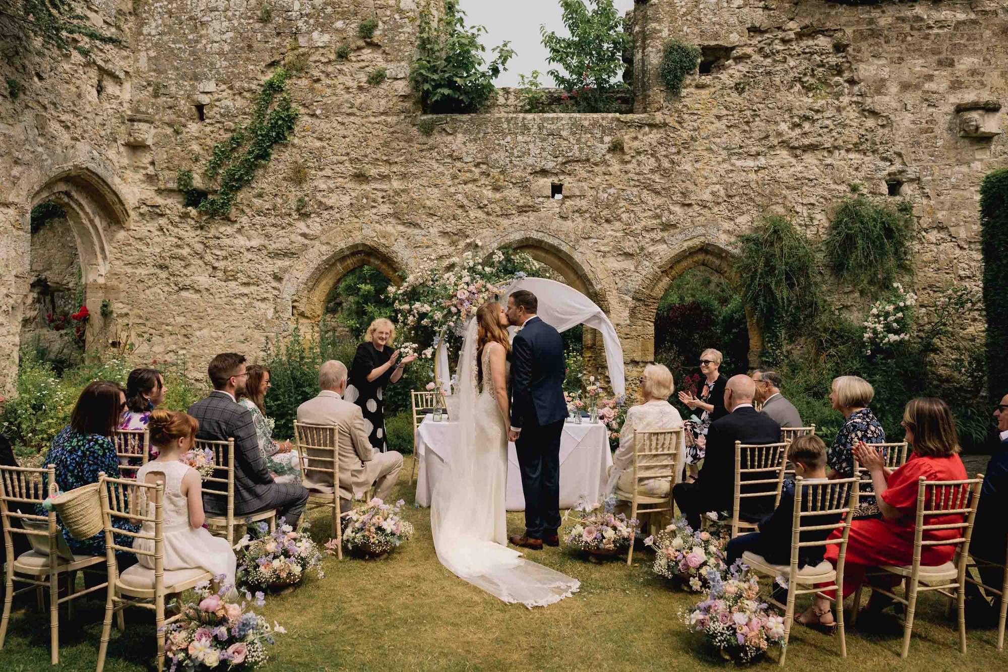 Bride and groom kiss on their wedding day at Amberley Castle.