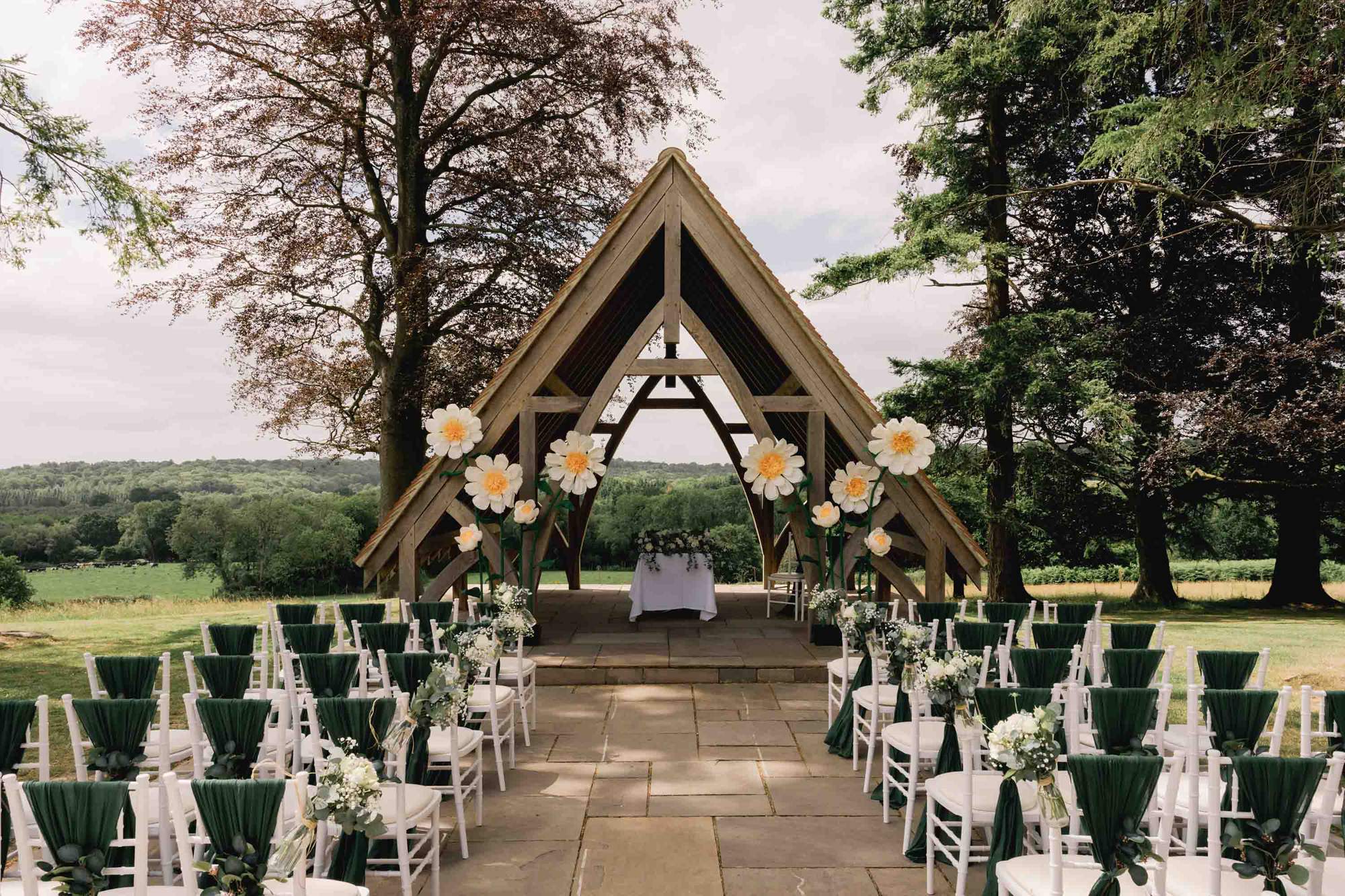 Outdoor ceremony set up at Highley Manor wedding venue with panoramic views across the Sussex countryside.