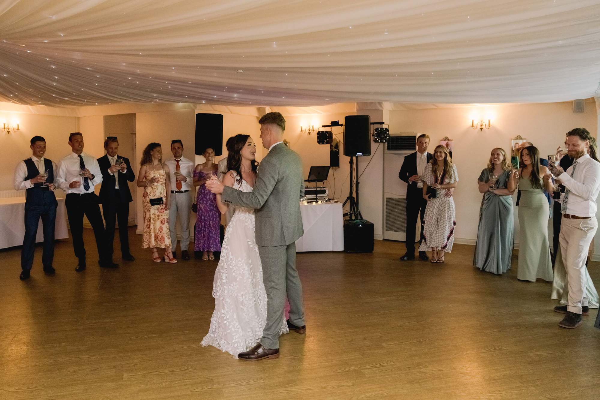 Bride and groom have their first dance together on their wedding day at Southdowns Manor.
