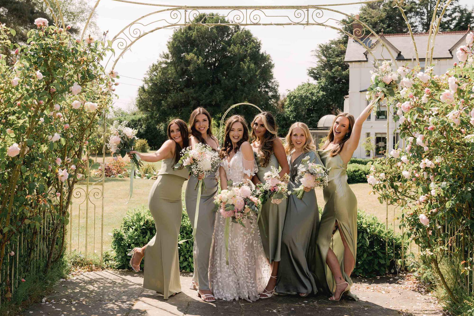 Bride and her bridesmaids at Southdowns Manor on a sunny day.