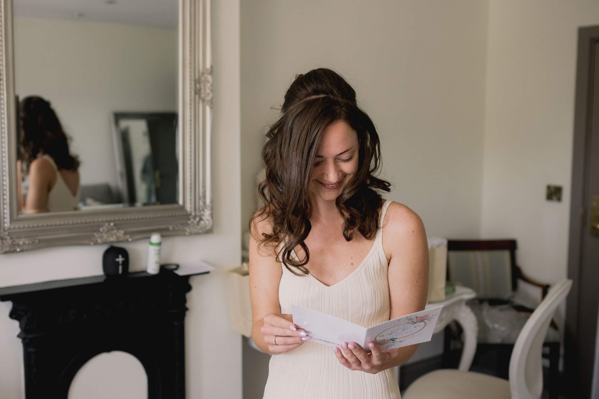 The bride receives a card with a heart-felt message from her husband to be at Southdowns Manor.