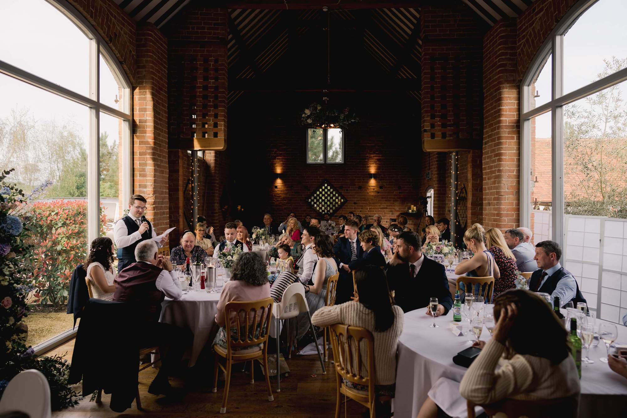 Groom delivers his speech at a wedding at Swallows Nest Barn in Warwickshire.