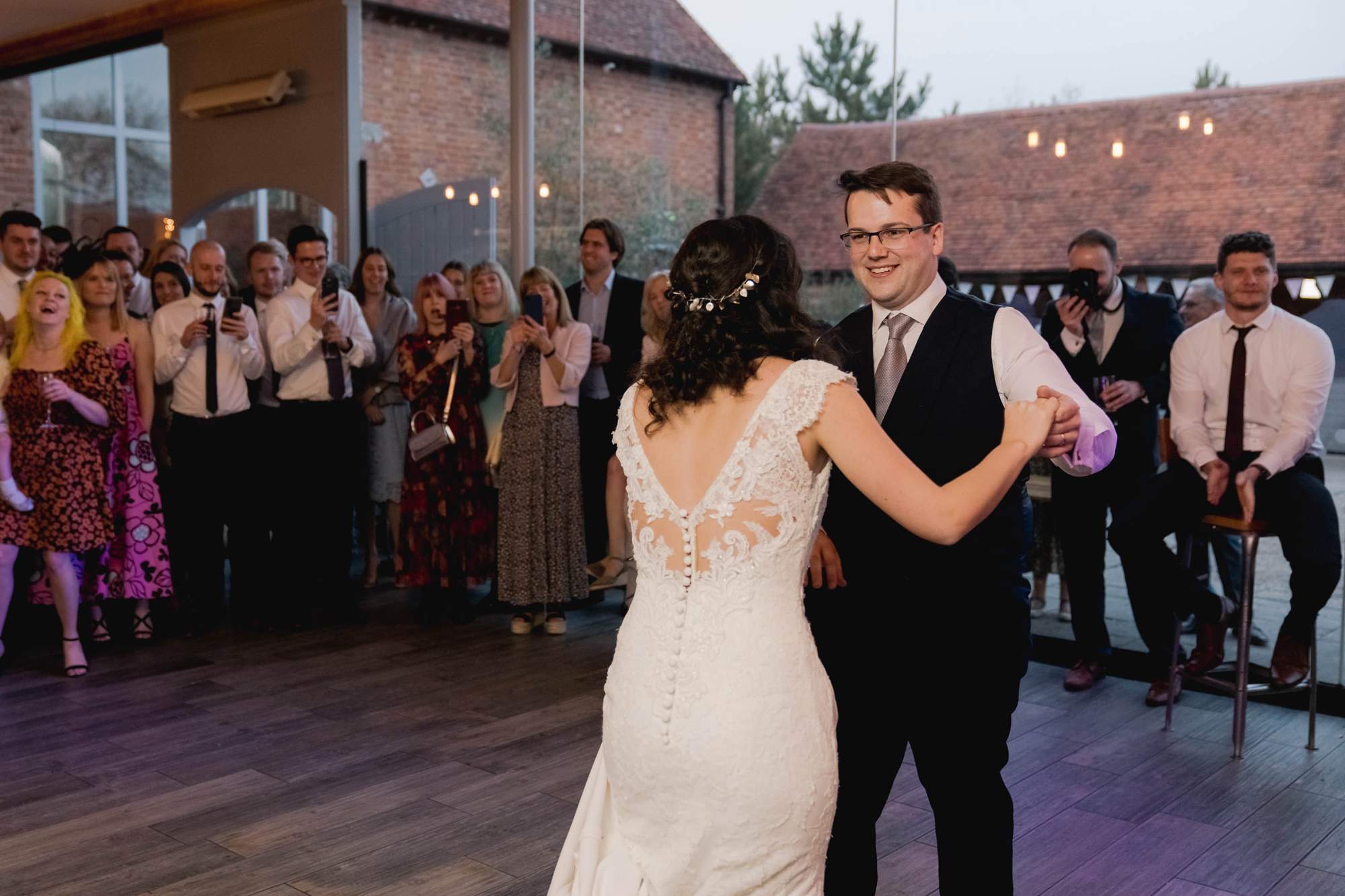 Bride and groom have their first dance together on their wedding day at Swallows Nest Barn in Warwickshire.