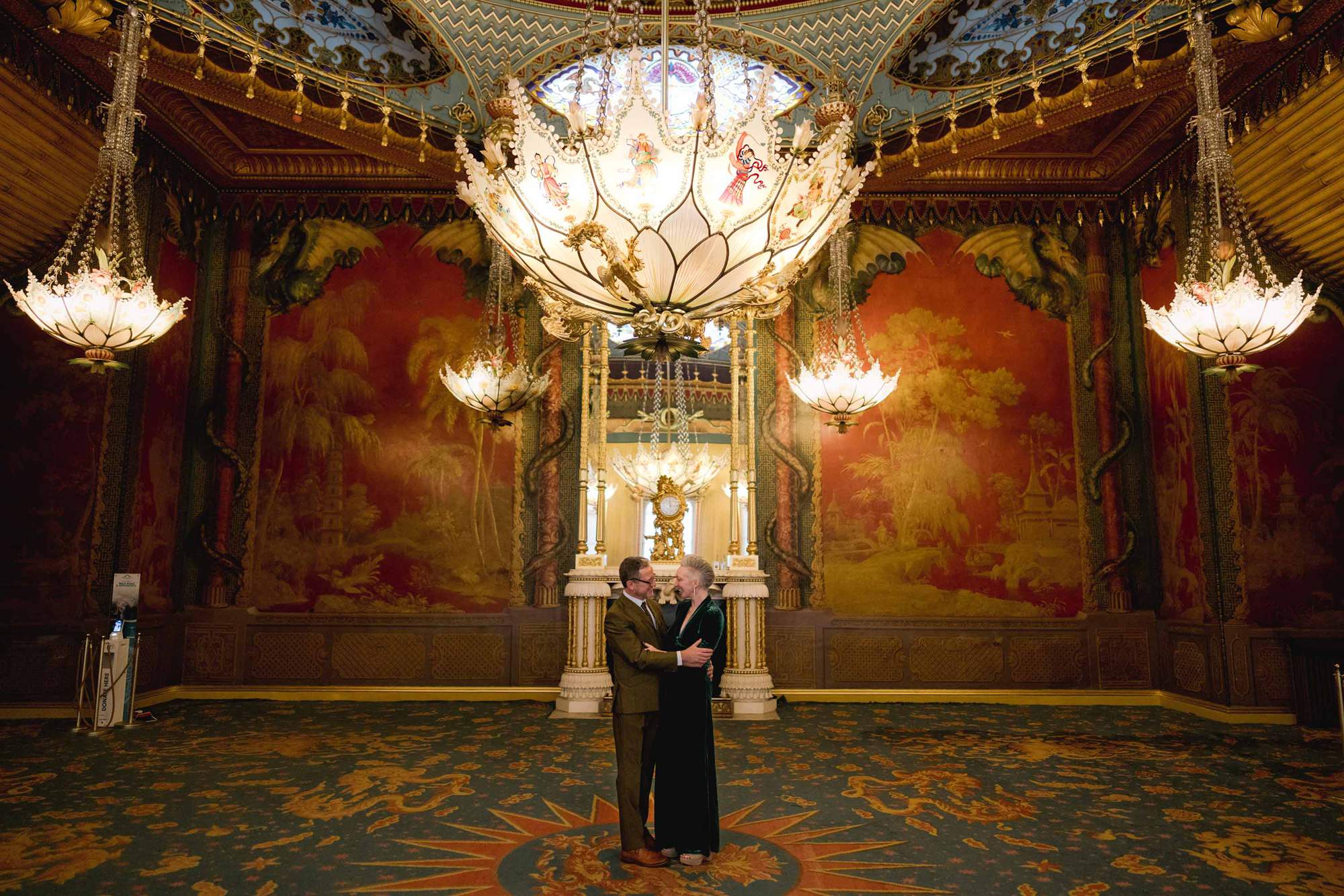 Bride and Groom embrace in the Music Room at the Brighton Royal Pavilion in East Sussex.
