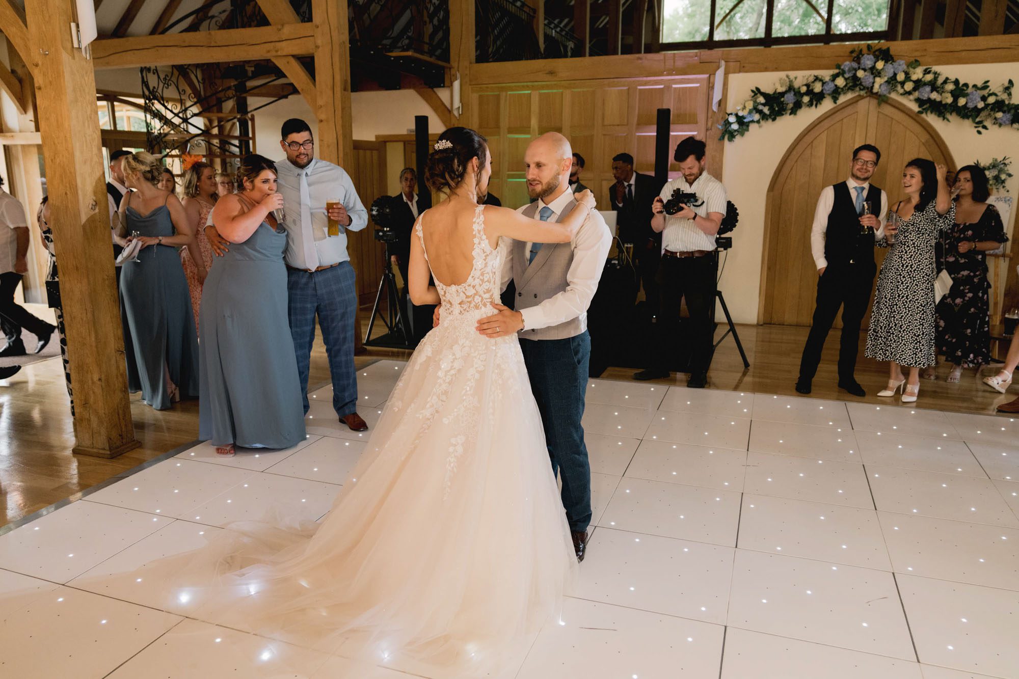 Bride and groom have their first dance together on their wedding day at Rivervale Barn in Hampshire.