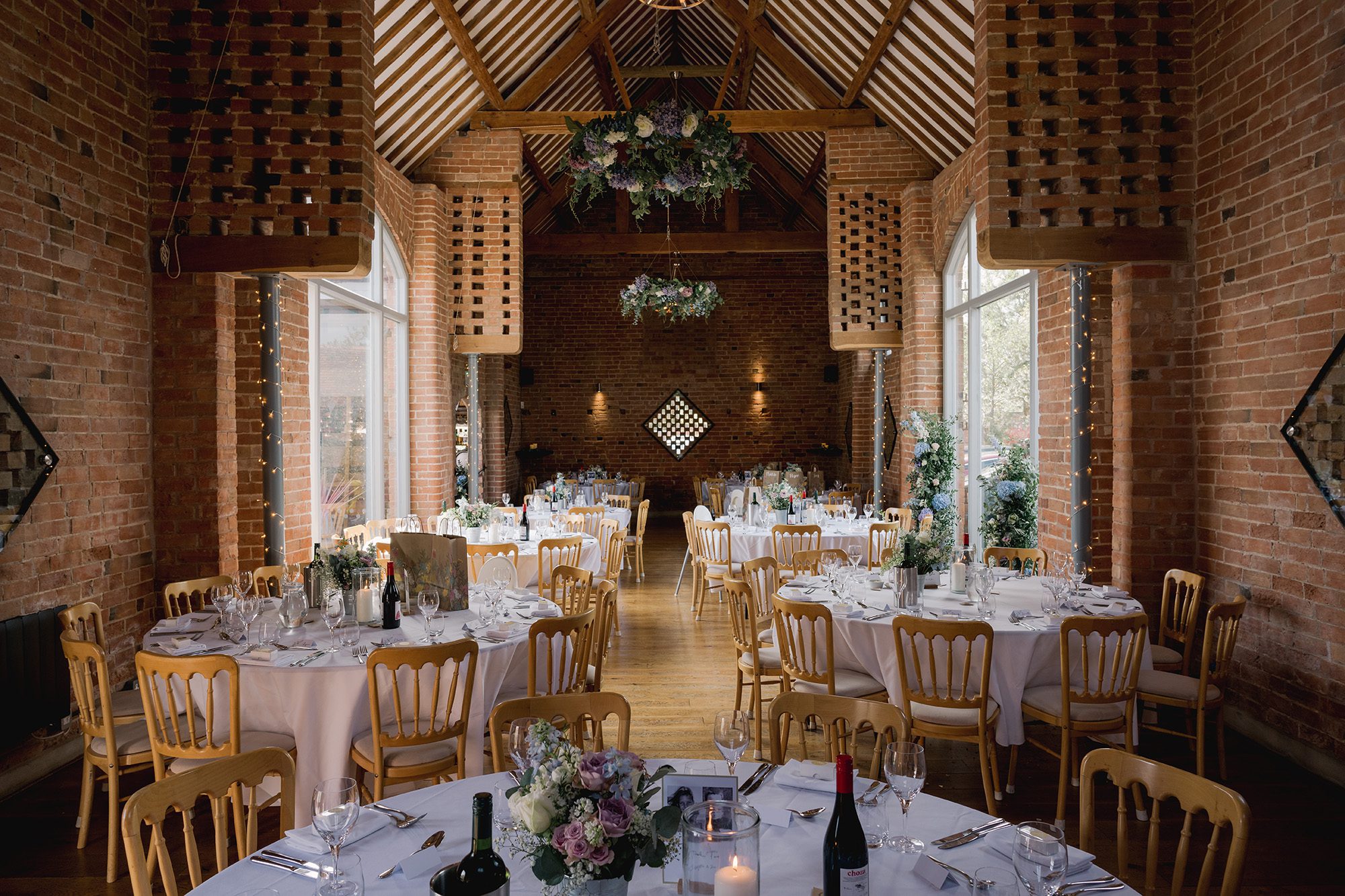 Reception tables all ready for a wedding at Swallows Nest Barn in Warwickshire.