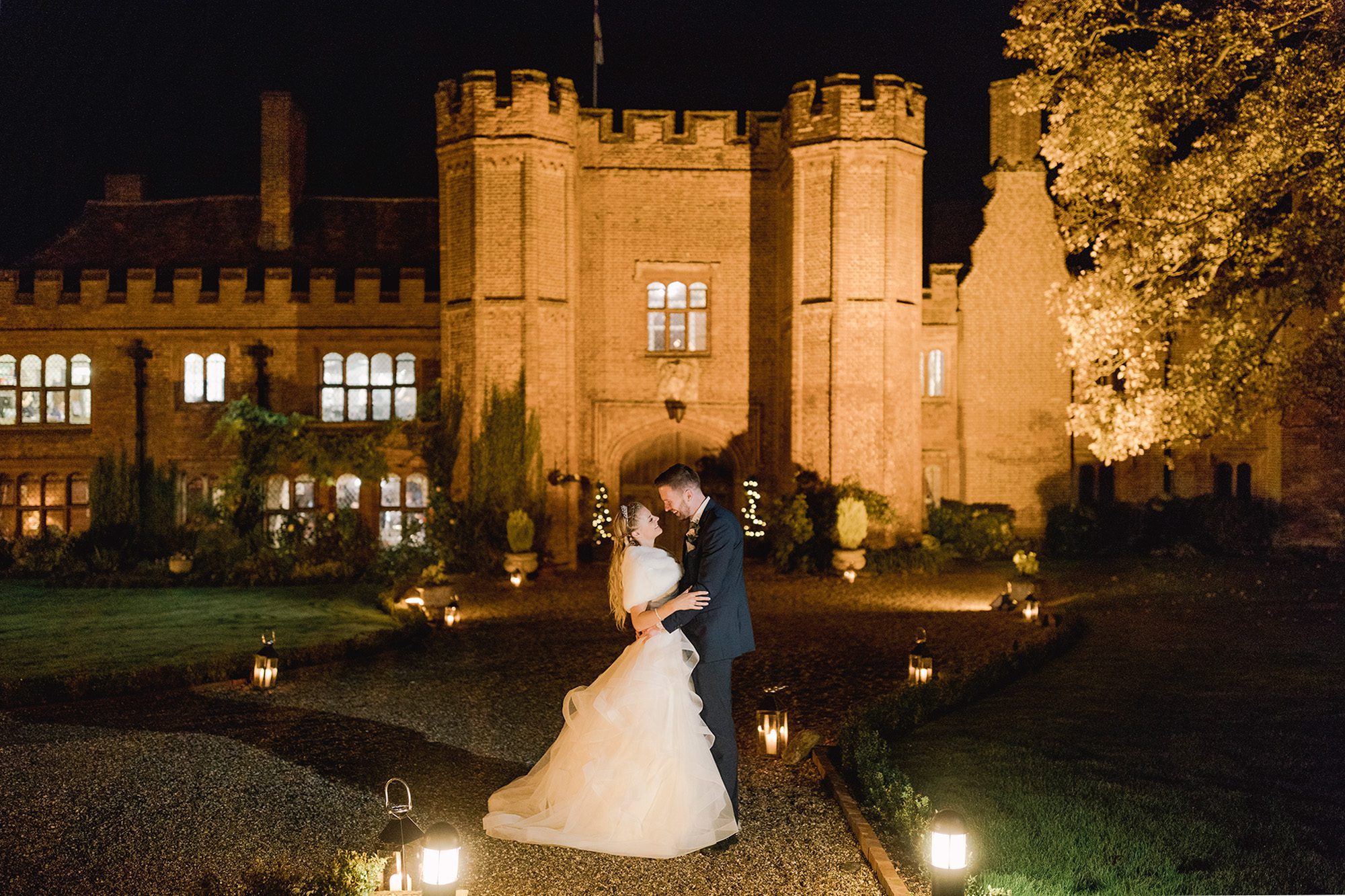 Bride and groom hug closely on their wedding day at Leez Priory in Essex.